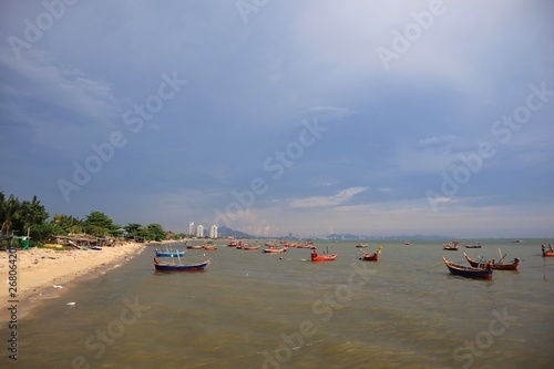 Fishing boat village community on the biue sky photo