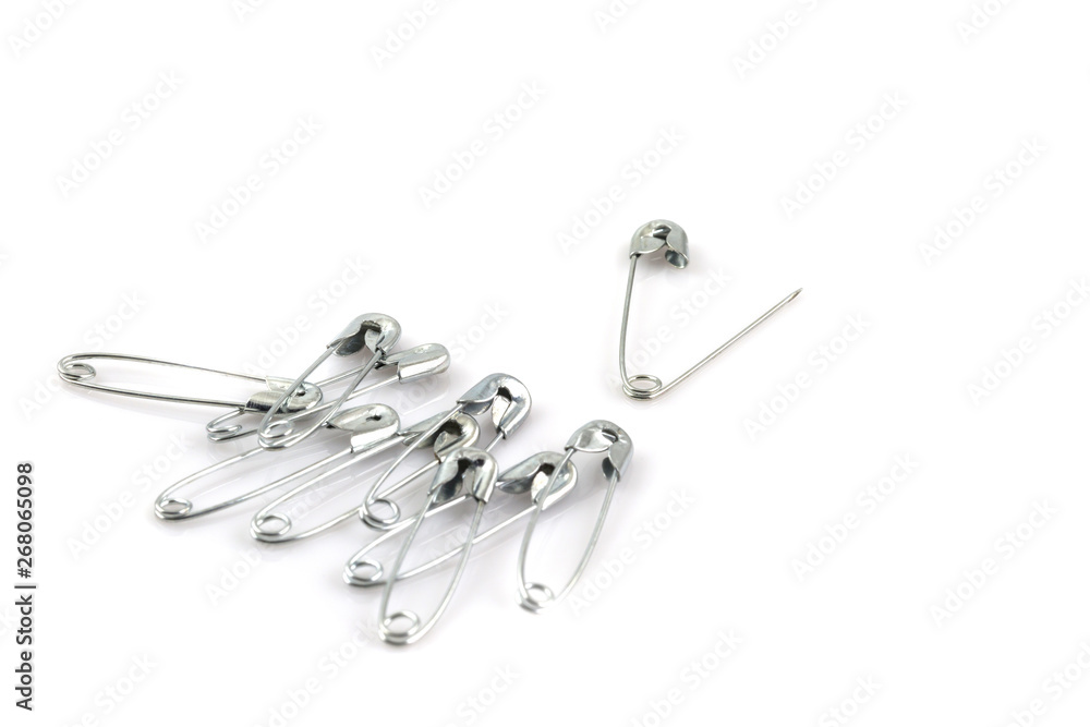 Bunch of safety pins isolated on white Bunch of safety pins isolated on white