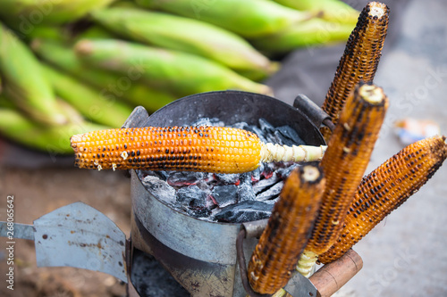 Sweet corn on the grill. Indian street food. Selective Focus.