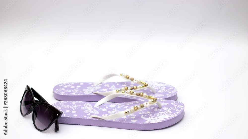 custom made wallpaper toronto digitalPurple slippers and sunglasses and sea shell on white background - Stop motion 