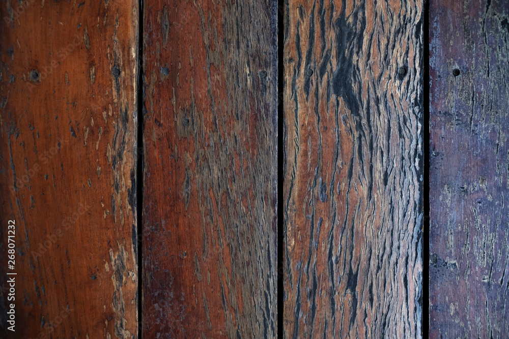 Naklejka premium Dark brown wood texture with natural striped pattern background