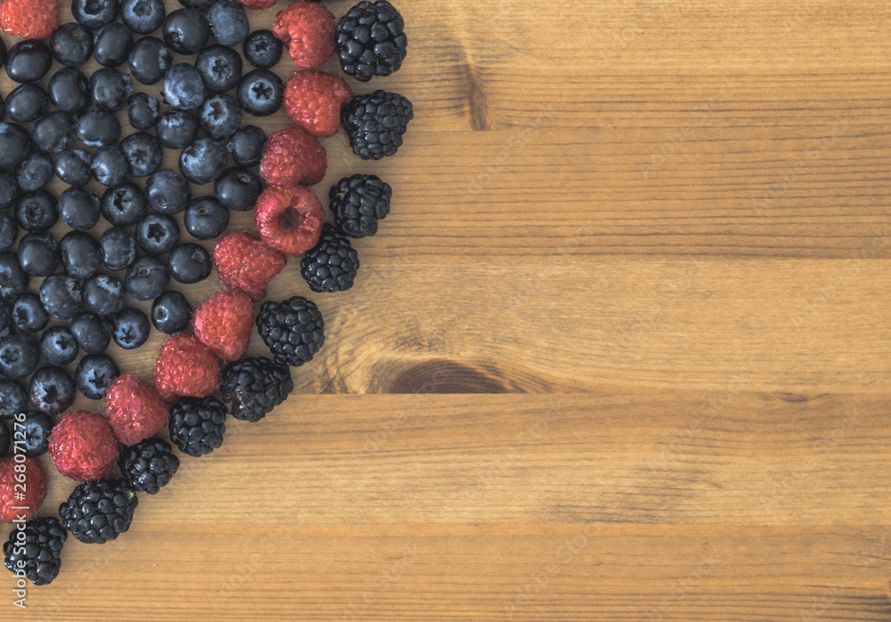 Berries on a wooden table Berries on a wooden table