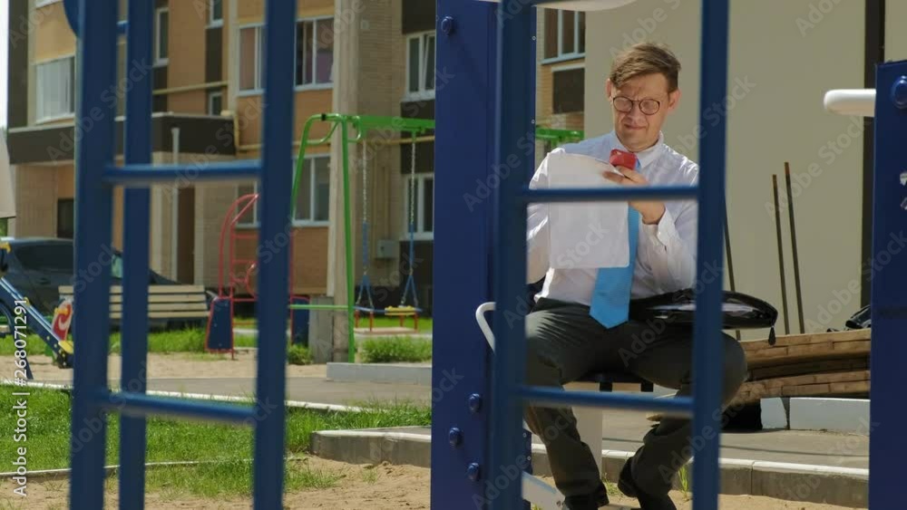 Businessman on an outdoor sports field. The concept of a healthy lifestyle. Businessman on an outdoor sports field. The concept of a healthy lifestyle.