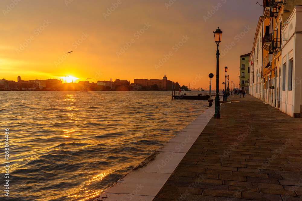 Fondamenta Zattere Allo Spirito and Venetian Lagoon on sunset. Venice. Italy
