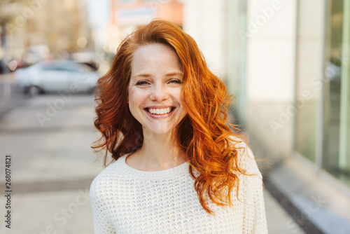 Happy friendly attractive young woman