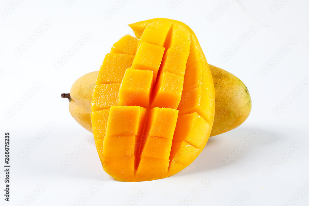 ripe yellow mango cut slice whole on white background