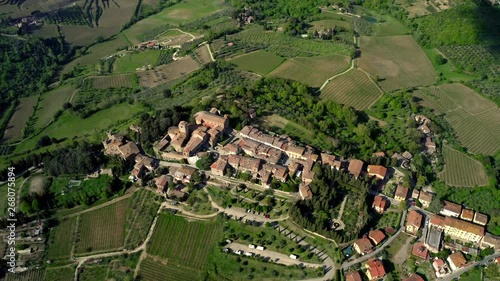 Amazing drone shot of Panzano in Chianti, Tuscany, Italy. Aerial view of a beautiful old town with church with bells tower photo