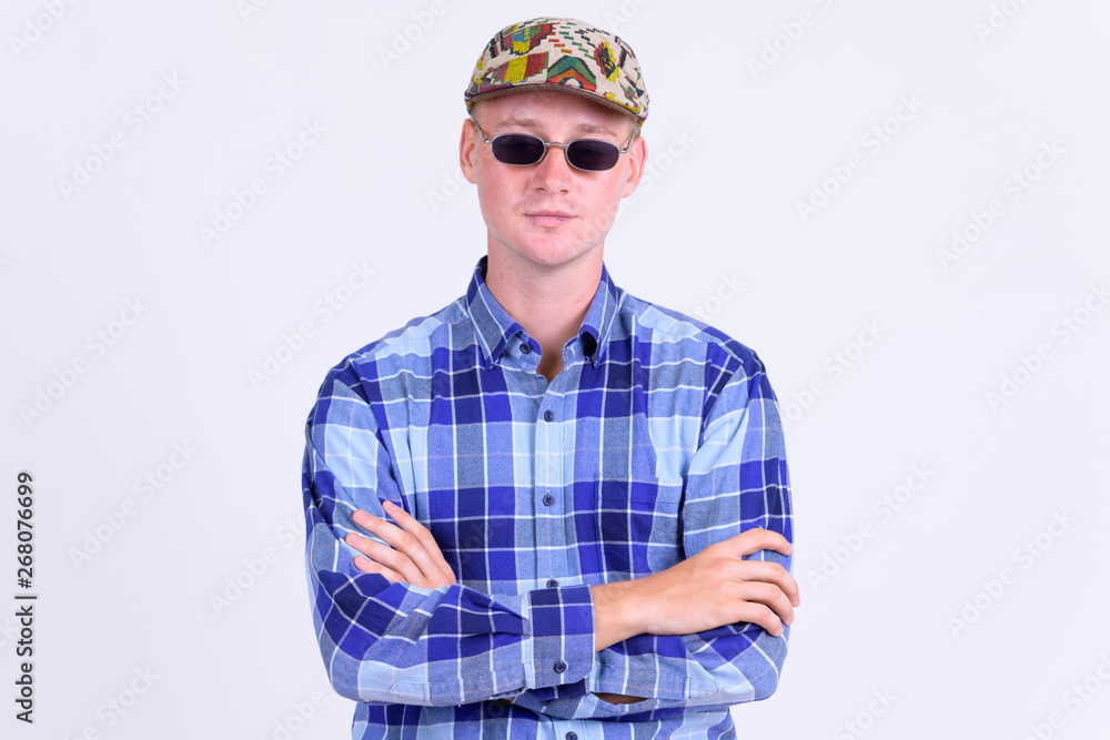 Portrait of young handsome hipster man with arms crossed Portrait of young handsome hipster man with arms crossed