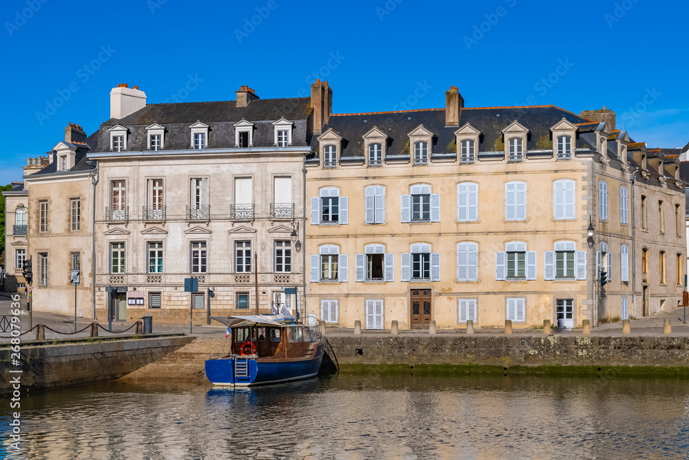Vannes harbor, in the Morbihan, Brittany, boat in the marina, with typical houses in background 