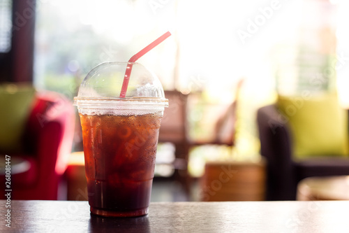 Iced americano coffee,Beverage in plastic glass,in summer season,Black coffee with sunshine
