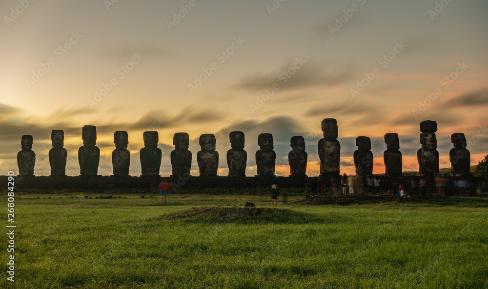 Sunrise behind Moai statues of Ahu Tongariki on Easter Island