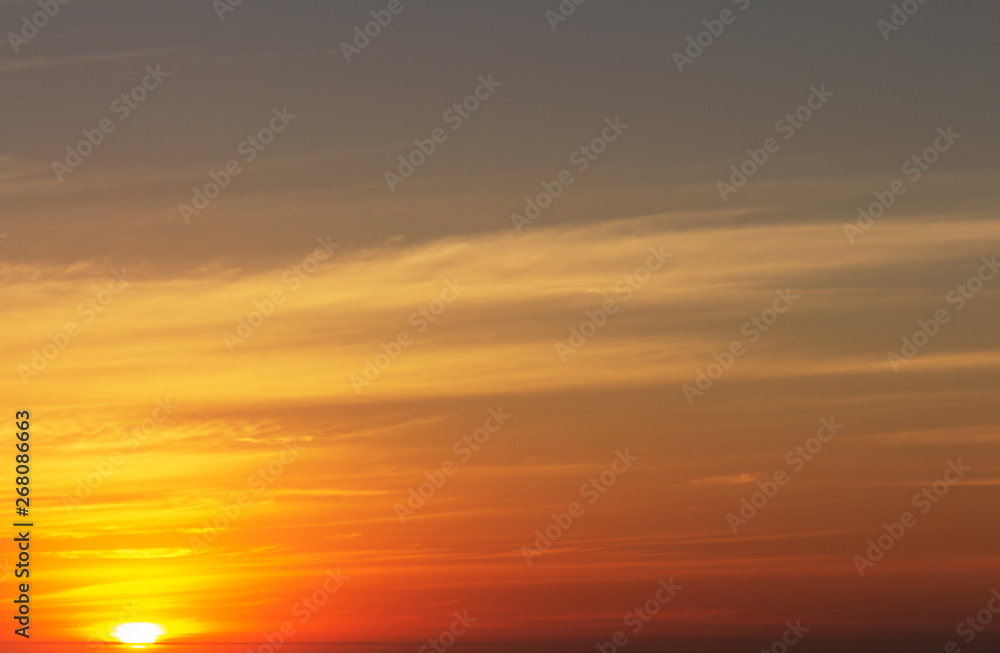beautiful red sunset and bright sun on the horizon