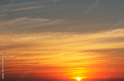 beautiful red sunset and bright sun on the horizon © Yuliia Lakeienko