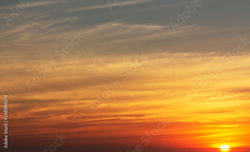 beautiful red sunset and bright sun on the horizon © Yuliia Lakeienko