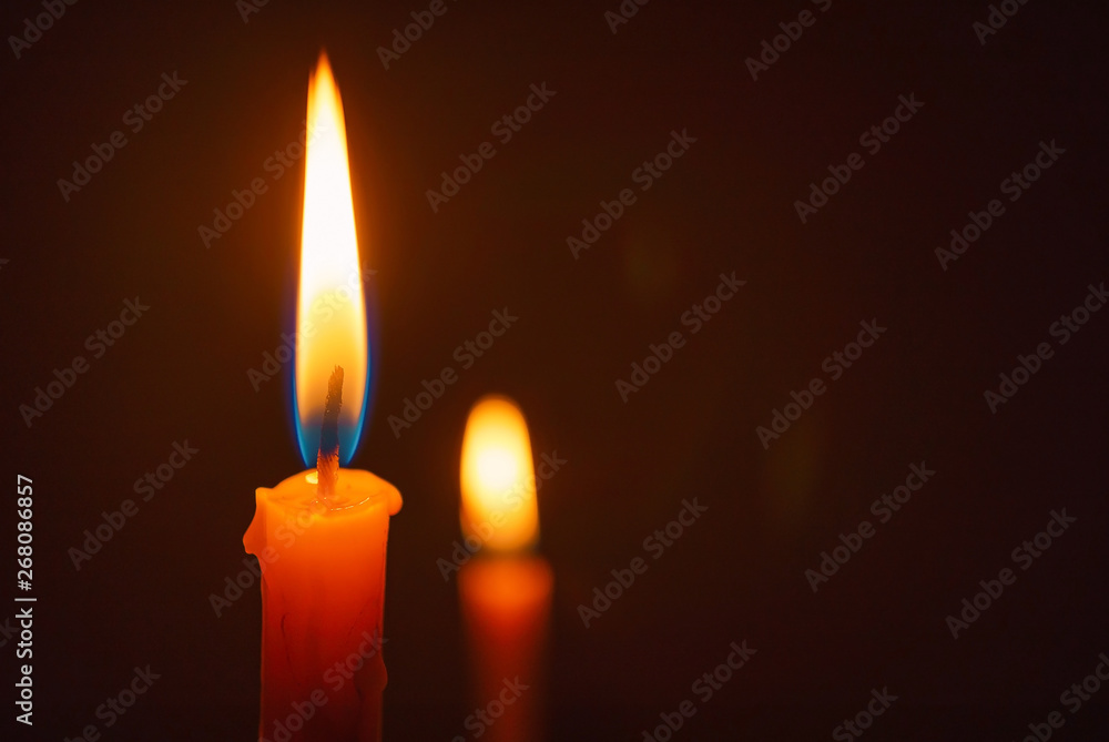 Candle lit in the dark, Candle flame at night. Lighting design for background. Candle lit in the dark, Candle flame at night. Lighting design for background.