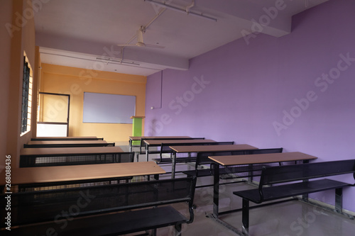 Empty class room and desks with colorful walls