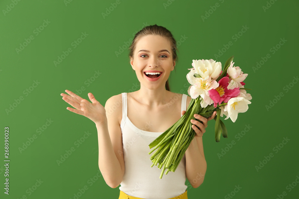 Happy young woman with bouquet of beautiful tulips on color background Happy young woman with bouquet of beautiful tulips on color background