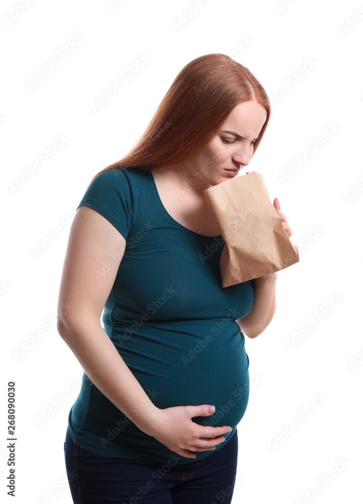 Young pregnant woman suffering from toxicosis on white background Young pregnant woman suffering from toxicosis on white background