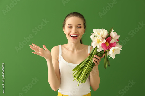 Happy young woman with bouq...