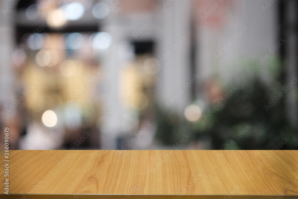 Empty dark wooden table in front of abstract blurred bokeh background of restaurant . can be used for display or montage your products.Mock up for space. Empty dark wooden table in front of abstract blurred bokeh background of restaurant . can be used for display or montage your products.Mock up for space.