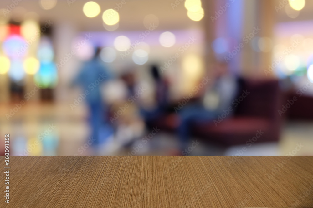 Empty dark wooden table in front of abstract blurred bokeh background of restaurant . can be used for display or montage your products.Mock up for space. Empty dark wooden table in front of abstract blurred bokeh background of restaurant . can be used for display or montage your products.Mock up for space.