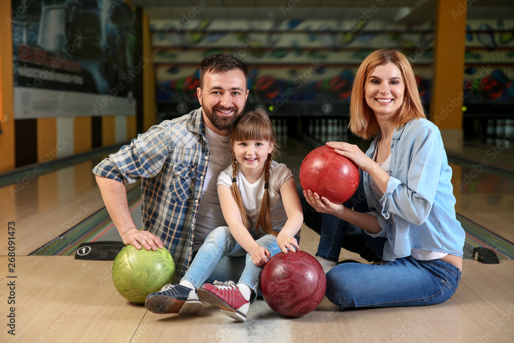 Fototapeta premium Happy family in bowling club
