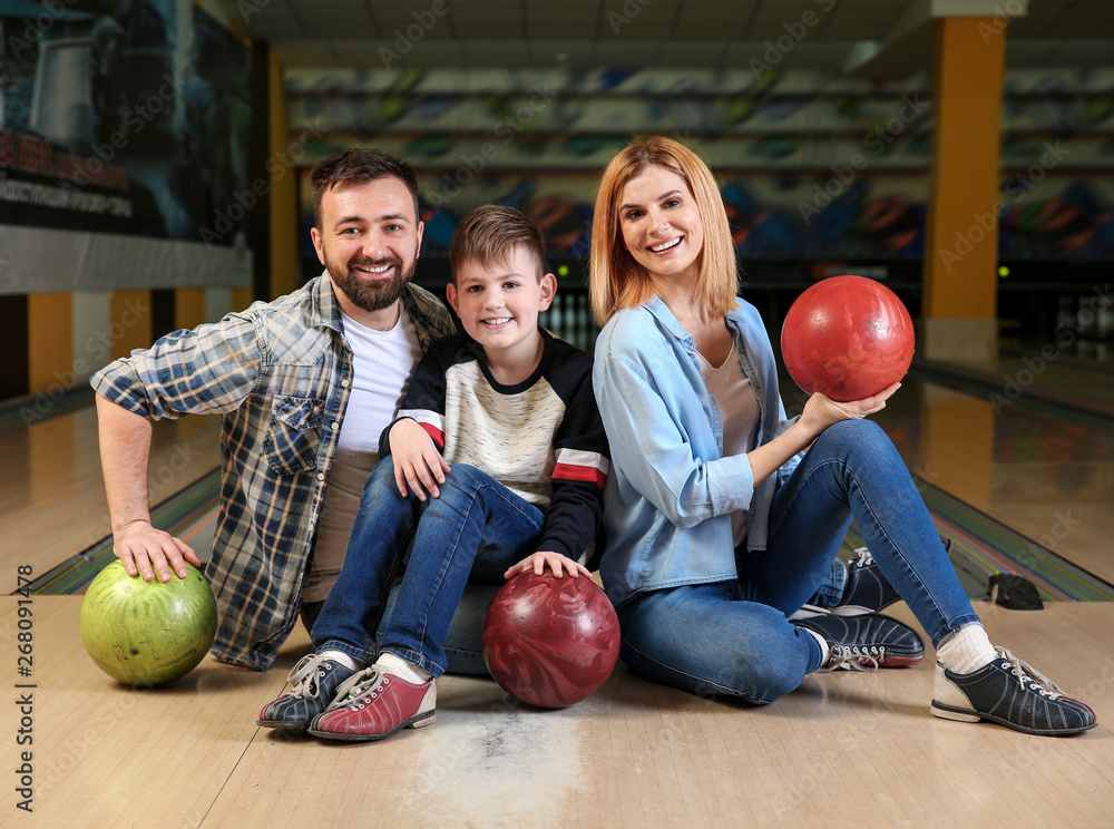 Fototapeta premium Happy family in bowling club