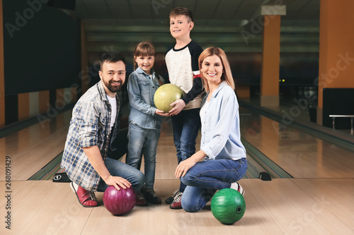 Happy family at bowling club