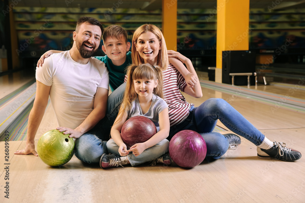 Fototapeta premium Happy family in bowling club