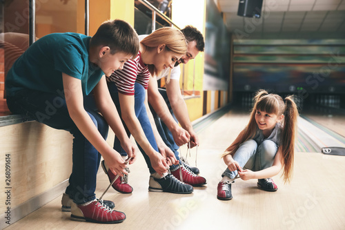 Family changing shoes befor...
