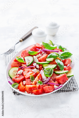 Summer salad with watermelon and salad leaves