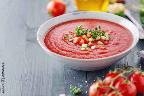 Tasty summer tomato soup served in bowl
