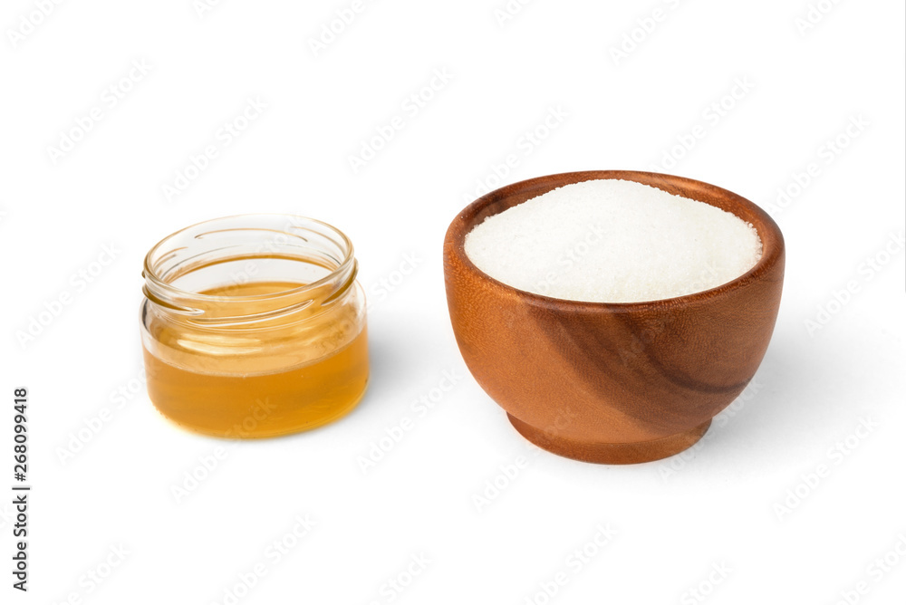 Honey and sugar isolated on white background. Honey and sugar isolated on white background.