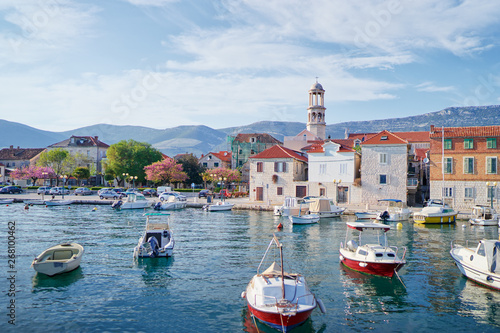 Fototapeta Naklejka Na Ścianę i Meble -  Kastel coast in Dalmatia,Croatia. A famous tourist destination on the Adriatic sea. Fishing boats moored in old town harbor.