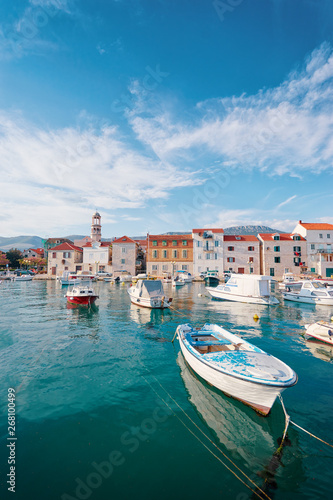 Kastel coast in Dalmatia,Croatia. A famous tourist destination on the Adriatic sea. Fishing boats moored in old town harbor. photo