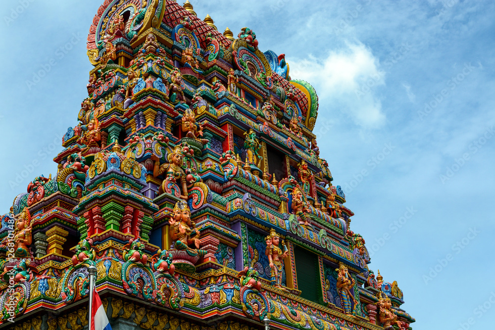 Ornate tower and carvings at Wat Phra Si Maha Utama Devi, an 1800s Hindu temple in Bangkok, Thailand