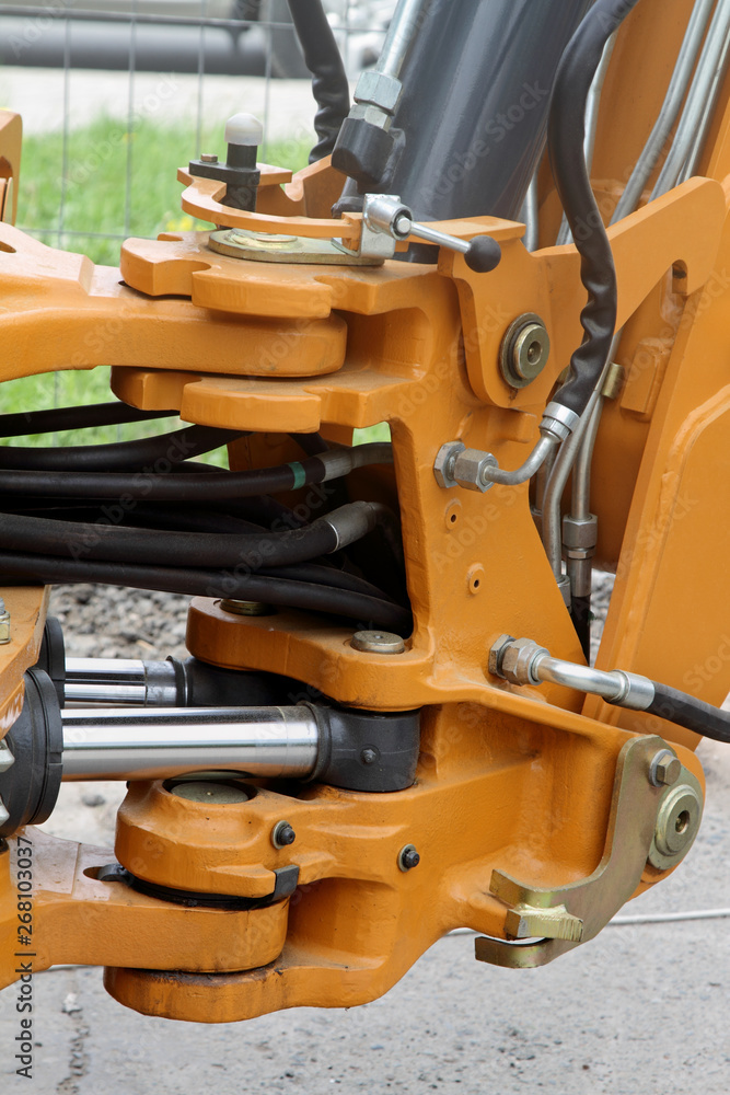 Swivel and hydraulic hoses on a tractor.