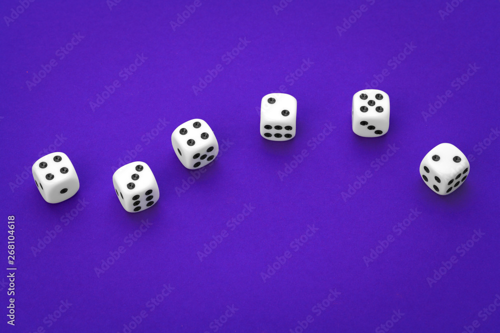 White dices against a blue background White dices against a blue background