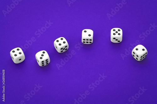 White dices against a blue background
