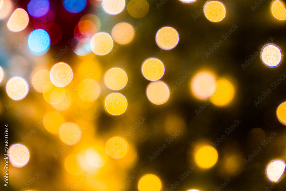 Blurred abstract background of Christmas lights.Brightly glowing yellow-orange balls and lines.Abstract color patterns Blurred abstract background of Christmas lights.Brightly glowing yellow-orange balls and lines.Abstract color patterns