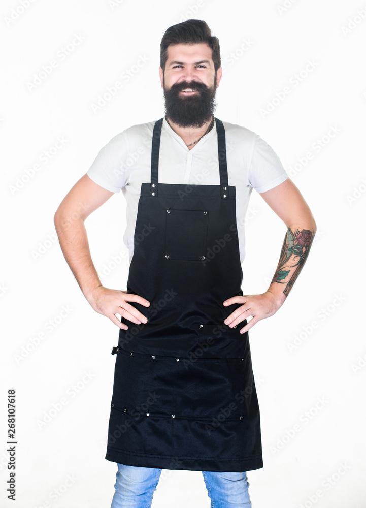 Let my happy smile warm your hearts. Happy man wearing barber or cooking apron. Bearded man happy smiling in bib apron. Brutal hipster with happy smile on unshaven face Let my happy smile warm your hearts. Happy man wearing barber or cooking apron. Bearded man happy smiling in bib apron. Brutal hipster with happy smile on unshaven face