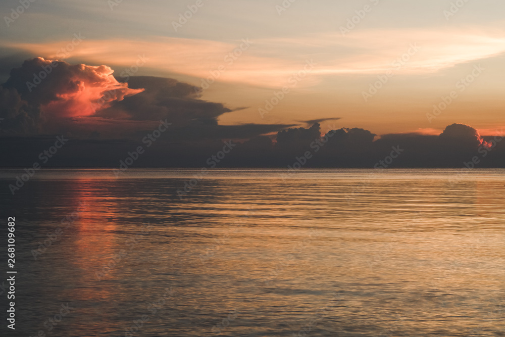 dramatic and beautiful sky in tropical sunset on the sea