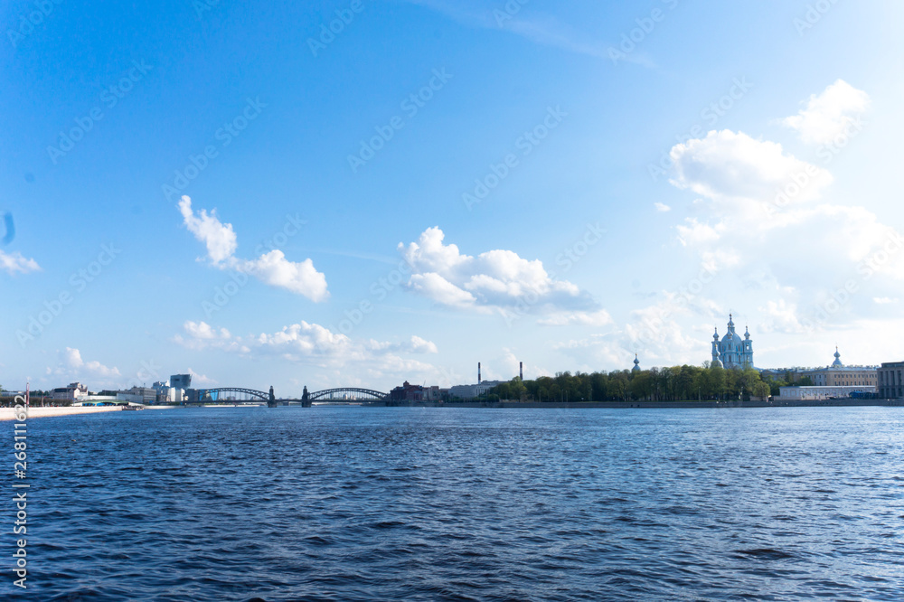 View from the Sverdlovsk Embankment, St. Petersburg. River Neva on the spring. Smolny Cathedral in the distance