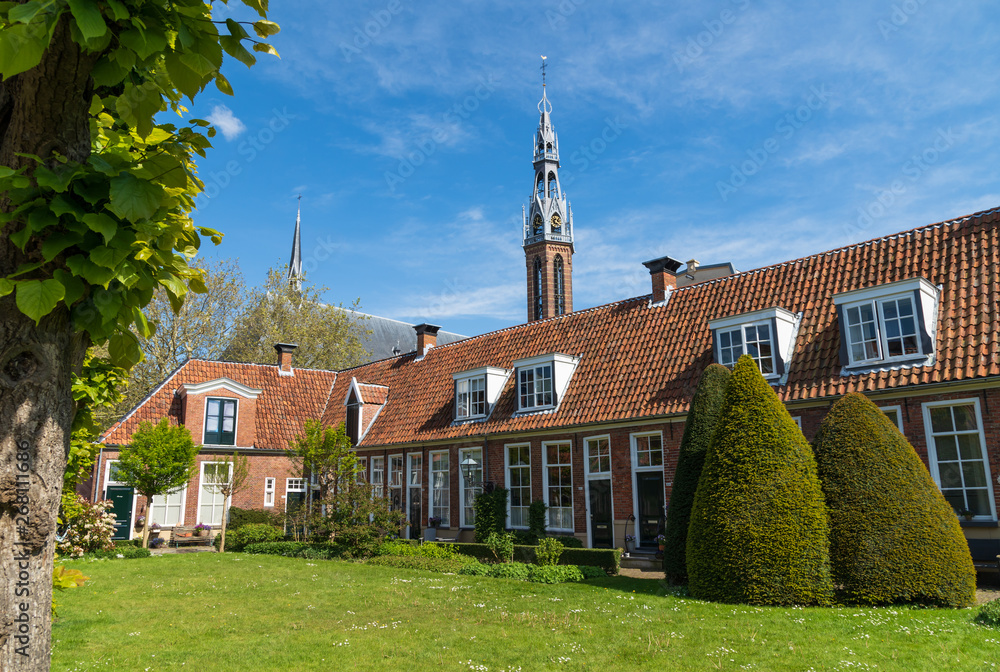 Old almshouses around a small, green courtyard (Sint Anthony Gasthuis) in the Dutch city of Groningen. Netherlands Old almshouses around a small, green courtyard (Sint Anthony Gasthuis) in the Dutch city of Groningen. Netherlands