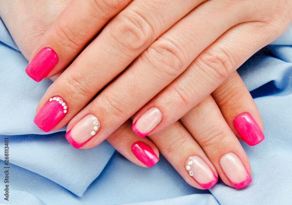 Woman's nails with beautiful pink manicure fashion design Woman's nails with beautiful pink manicure fashion design