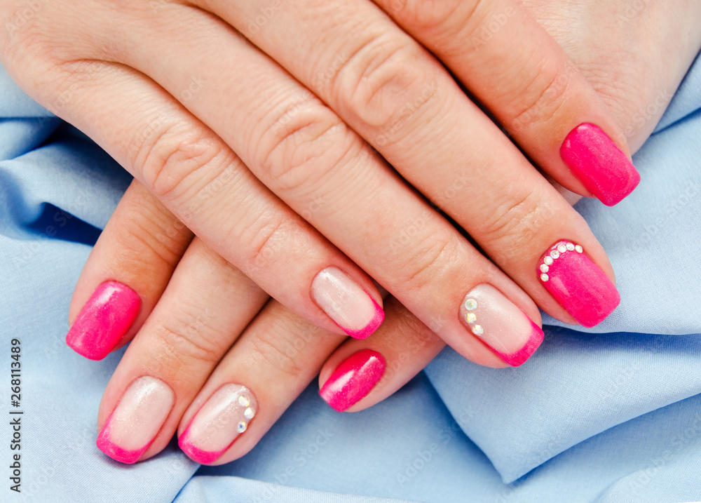  Woman's nails with beautiful pink manicure fashion design