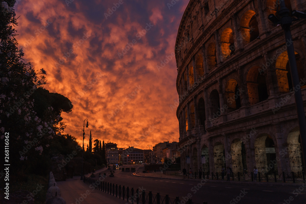 Roman Colosseum and fiery sky, beautiful landscape | ROME, ITALY - 12 SEPTEMBER 2018.