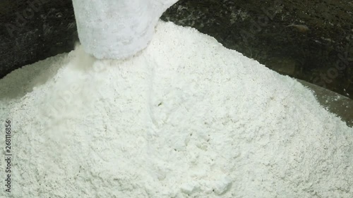 flour pours out of the bag,bread production photo