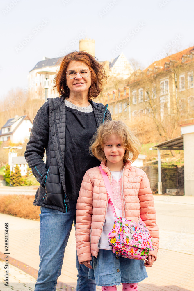 Woman with child in front of Scharfenstein Castle in the Erzgebirge Woman with child in front of Scharfenstein Castle in the Erzgebirge