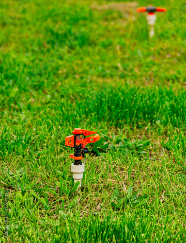 Wallpaper Mural Automatic lawn sprinklers in grass in bad condition is not working Torontodigital.ca
